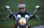 Young boy driving motorcycle giclee art print