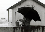 Holidaymaker under umbrella, Thorpe Bay 1970 giclee art print