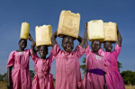 Schoolgirls carry water in Katine village 2009 giclee art print