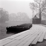 Boats lined up at a lake in an english park giclee art print