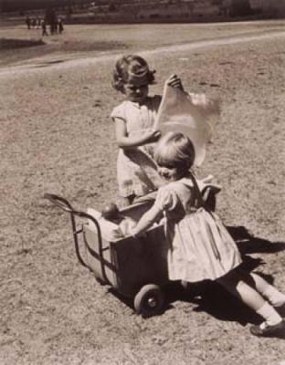 Children playing with a pram art print by Anonymous