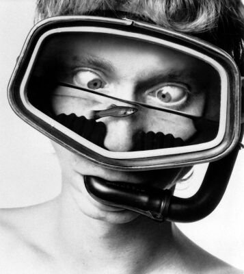 Diver with a fish in his mask