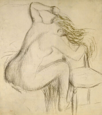 A Seated Woman Styling Her Hair