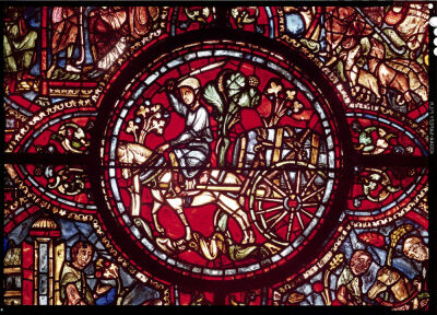 Window depicting a wine merchant transporting a barrel of wine