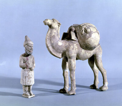 Funerary statuettes of a laden camel and a barbarian caravanner Tang Dynasty