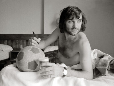 George Best signing football on holiday in Marabella